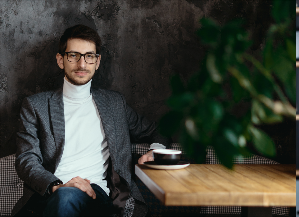 man smiling while in office